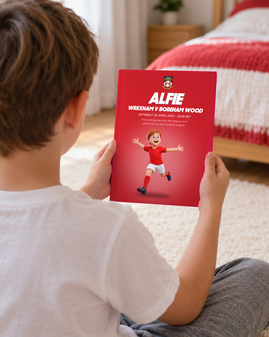 Illustrative image, not a real customer: an illustrated child holding up the book Wrexham v Boreham Wood, Personalised edition with a sample name and avatar.